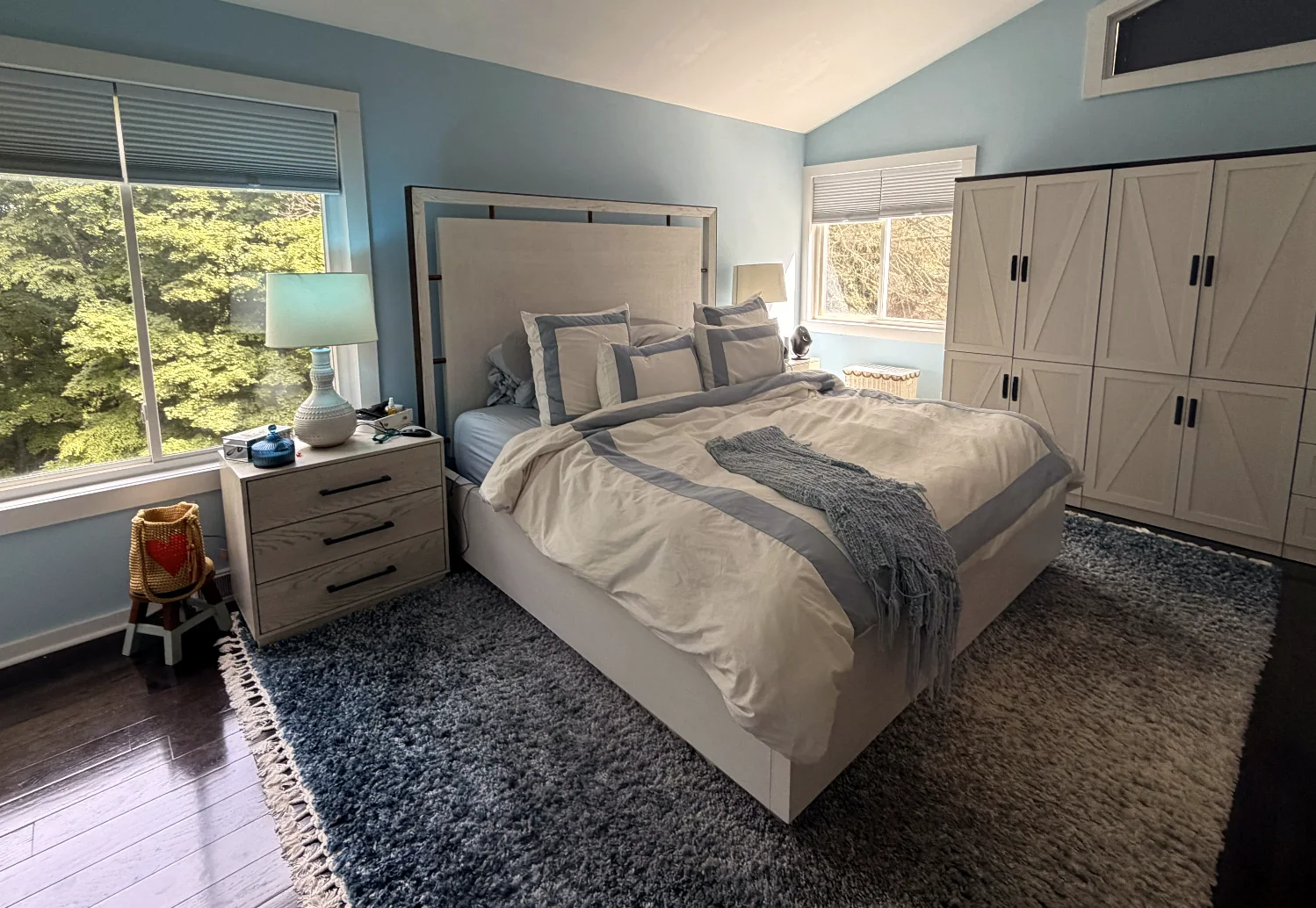 Light-filled bedroom with a large bed and windows